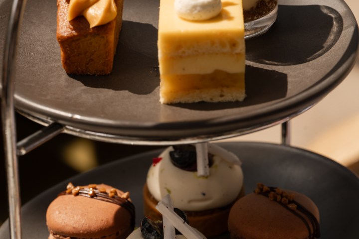 Assortment of desserts on a multi-tiered stand.